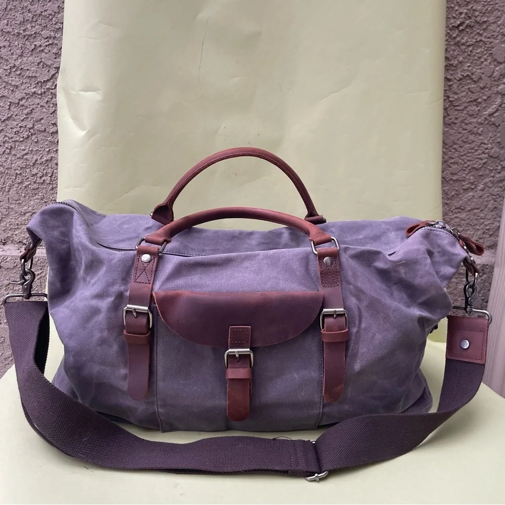 Grayish brown cotton/leather travel bag